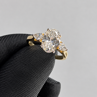 1.70 CT Oval Lab-Grown Diamond Ring with Pear Side Stones