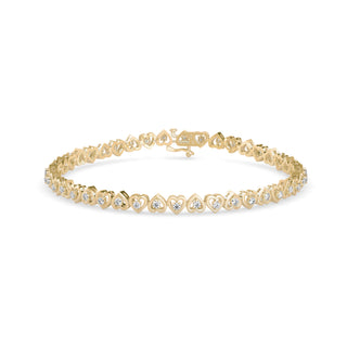 Graceful tennis bracelet featuring heart-shaped links and 2.62 ct round diamonds in 8.81 gm of 18kt gold. Lab grown diamond jewellery for an ethical choice.