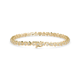 Graceful tennis bracelet featuring heart-shaped links and 2.62 ct round diamonds in 8.81 gm of 18kt gold. Lab grown diamond jewellery for an ethical choice.